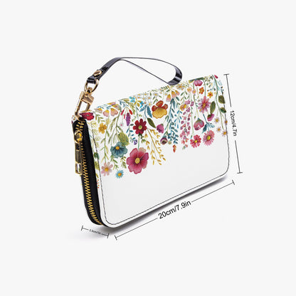 Floral-patterned handbag with measurements on a white background