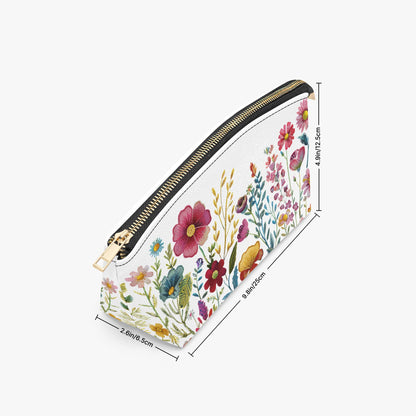 Floral-patterned pouch with a gold zipper on a white background